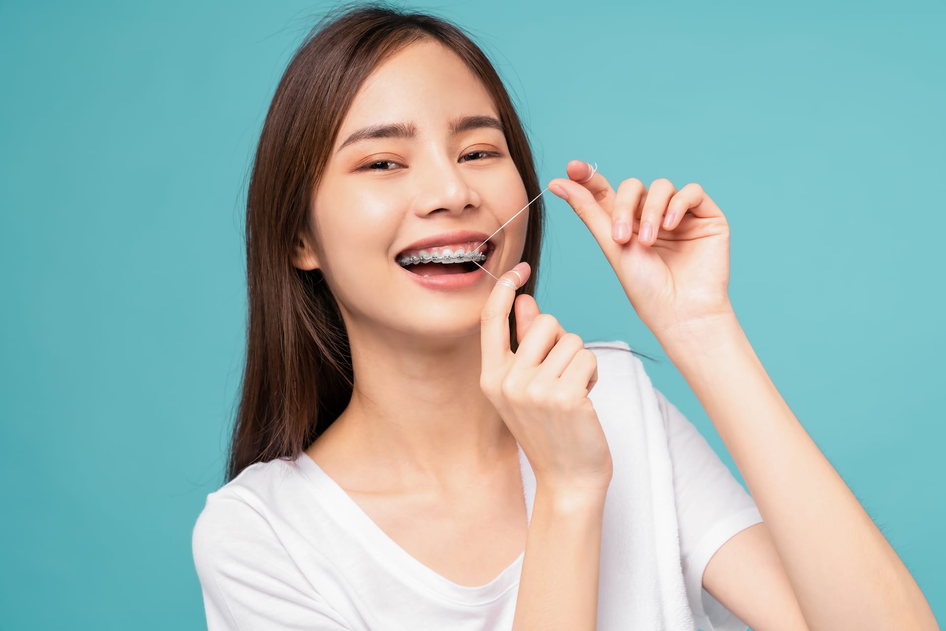 Tips for Flossing With Braces Hamilton & Manuele Orthodontics